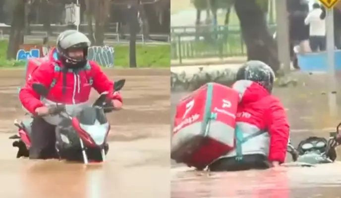 "No la hace partir más": Repartidor se vuelve viral tras intentar cruzar calle inundada en Talca